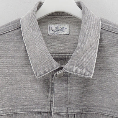 【Unlikely/アンライクリー】<br>Unlikely Time Travel Trucker Jacket Gray Denim <br>U25F-18-0011